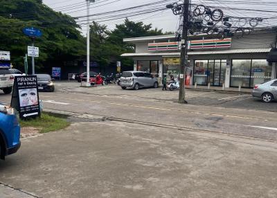 Street view with convenience store and parking area