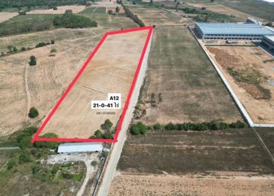 Aerial view of an open plot of land available for development