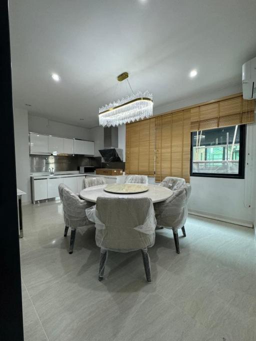 Modern kitchen with dining area and natural light