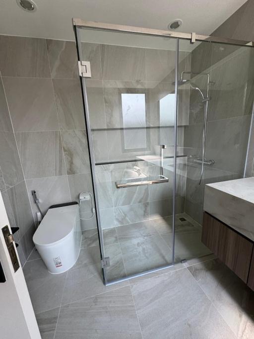 Modern bathroom with glass shower enclosure and sleek design
