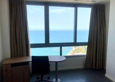 Office space with ocean view through large window