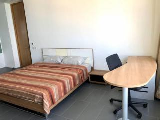 Spacious bedroom with double bed and desk