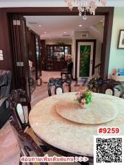 Elegant dining room with chandelier and marble table