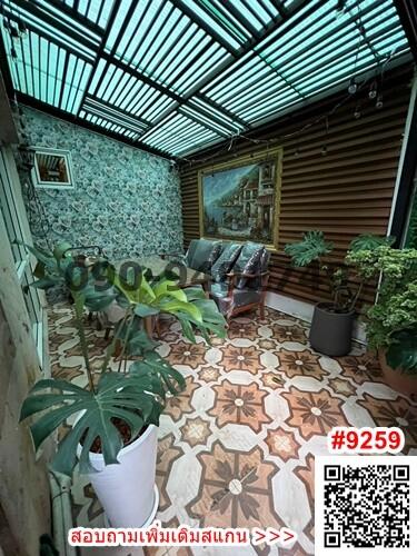 Enclosed patio space with patterned tile flooring and an array of plants