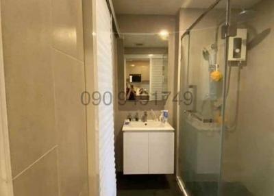 Modern bathroom interior with vanity and glass shower enclosure