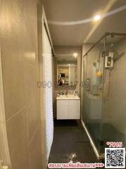 Modern bathroom interior with vanity and glass shower enclosure