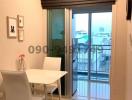 Cozy dining area with natural light near the balcony of an apartment