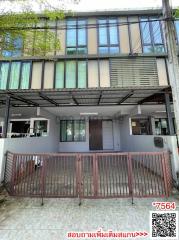 Modern two-story residential townhouse with gated entrance