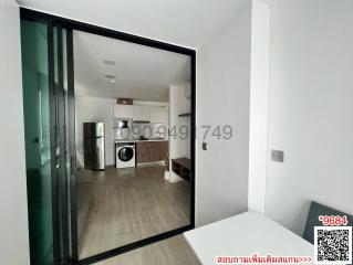 Modern apartment interior view showing kitchen and living area