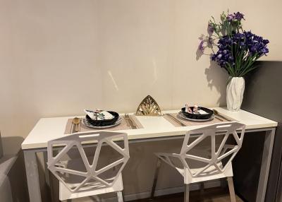 Cozy dining area with modern white table and chairs