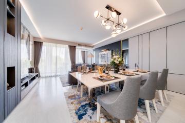Modern and spacious living and dining area with elegant furniture and natural light