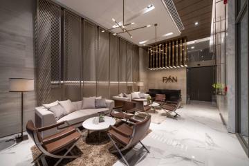Modern and sleek living room with designer furniture and elegant lighting