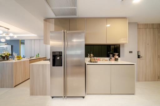 Modern spacious kitchen with large refrigerator and central island