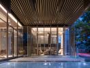 Modern building exterior at twilight with illuminated interiors and stylish wooden slats design