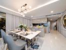 Modern dining area adjacent to an open-plan kitchen with elegant furnishings