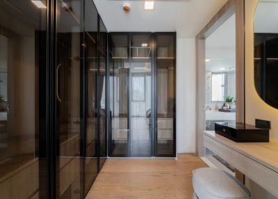 Modern bedroom with glass sliding doors and wooden floor