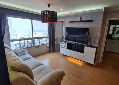 Modern living room with comfortable seating and city view