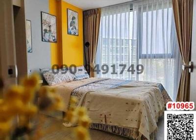 Bright and cozy bedroom with a comfortable bed and artistic decor