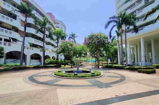 Stylish residential complex with a central fountain and manicured gardens
