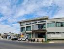 Modern commercial building facade with parking spaces