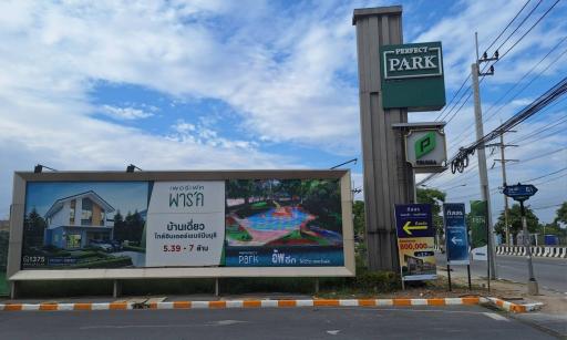 Outdoor billboard advertising real estate property with details and pricing