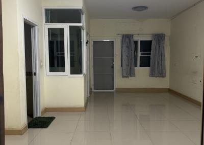 Empty interior of a residential space with tiled flooring