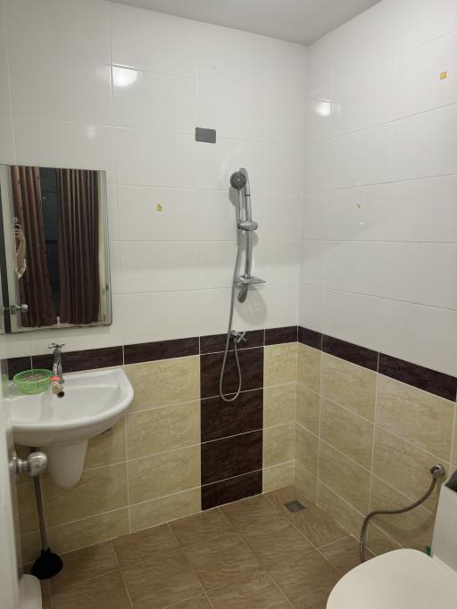 Modern bathroom with walk-in shower and white tiling