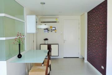 Modern compact kitchen with dining area in a bright apartment