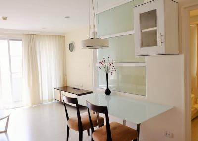 Modern minimalist dining area with abundant natural light