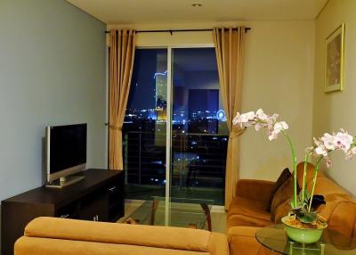 Cozy living room with city view at night