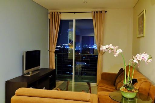 Cozy living room with city view at night