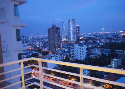View from the balcony overlooking the city skyline during dusk