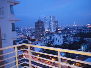 View from the balcony overlooking the city skyline during dusk