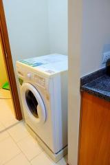 Compact laundry area with washing machine