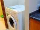 Compact laundry area with washing machine