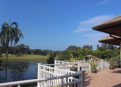 Spacious balcony with a scenic view of the golf course and water feature