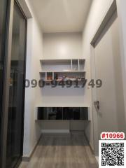 Modern hallway interior with shelving unit and wooden flooring
