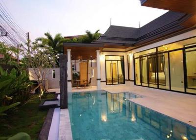 Modern house exterior with swimming pool at twilight