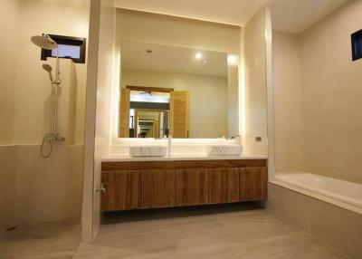 Modern bathroom with dual sinks and large mirror