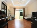 Cozy living room with piano and natural light