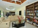 Spacious living room with bookshelf and modern appliances