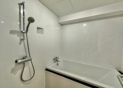 Modern white bathroom with bathtub and shower