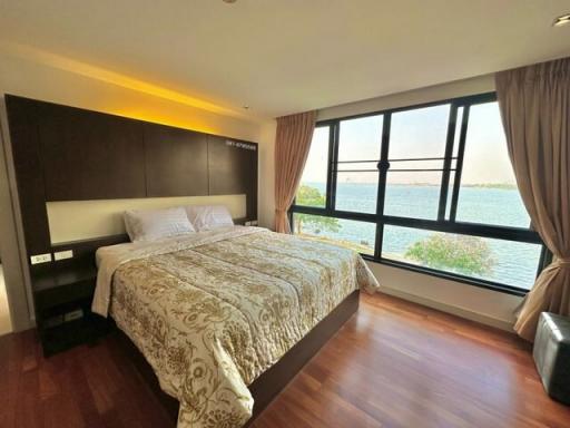 Bedroom with lake view and ample natural light