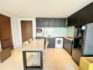 Modern kitchen with integrated appliances and ample counter space in a bright apartment