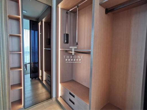 Spacious bedroom walk-in closet with built-in storage