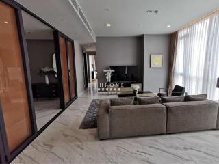 Spacious and modern living room with large windows and luxurious finishes