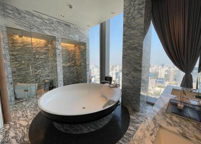 Luxurious bathroom with a large bathtub and city view
