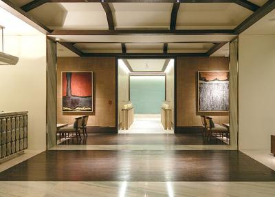 Elegant hallway interior with wood accents and art decor