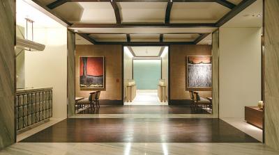 Elegant hallway interior with wood accents and art decor