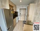 Modern kitchen with stainless steel appliances and wooden cabinetry